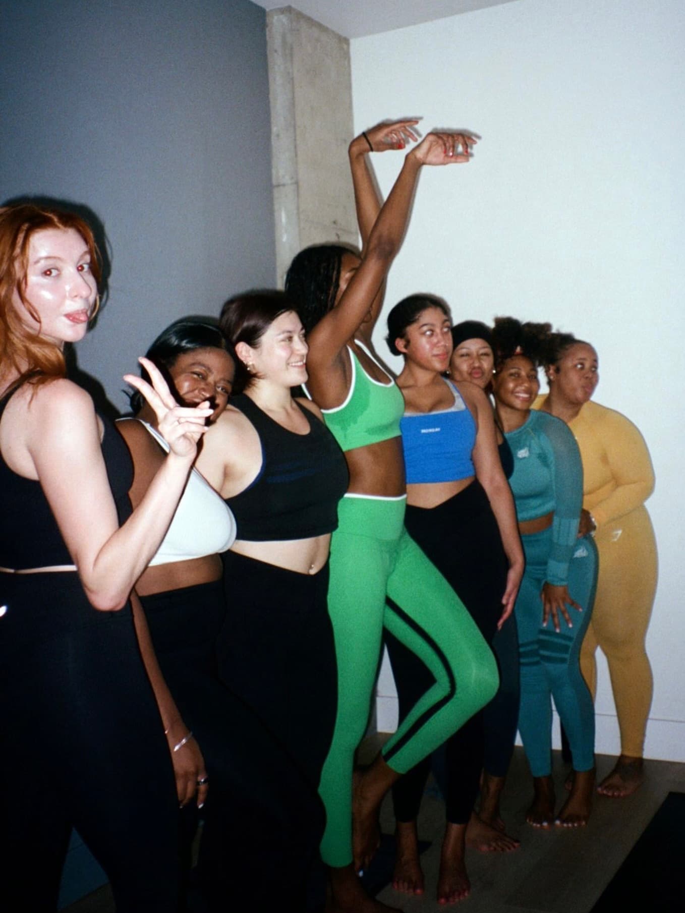 A line of members posing together after class