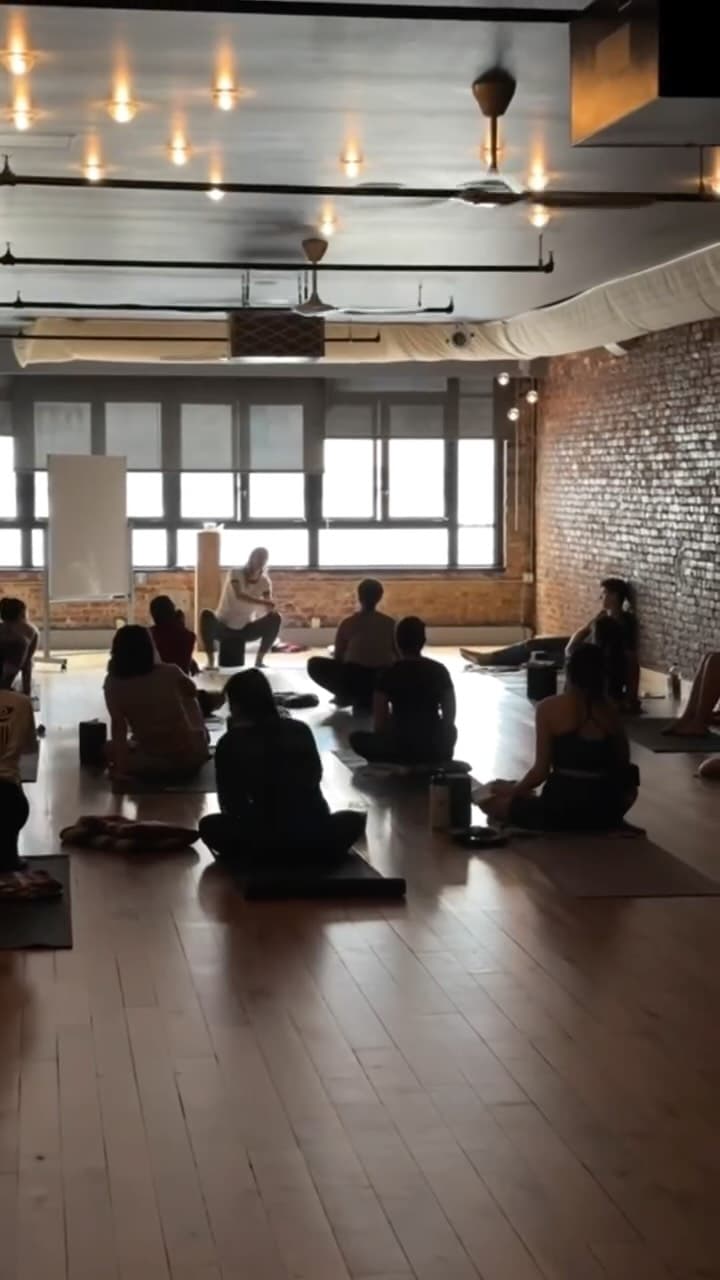A teacher-training class listening to an instructor